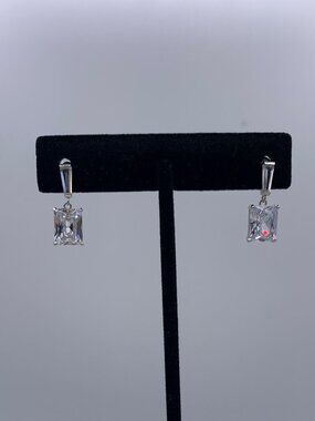 New no tags.  Earrings in solid sterling silver, lab diamond emerald cut drops.